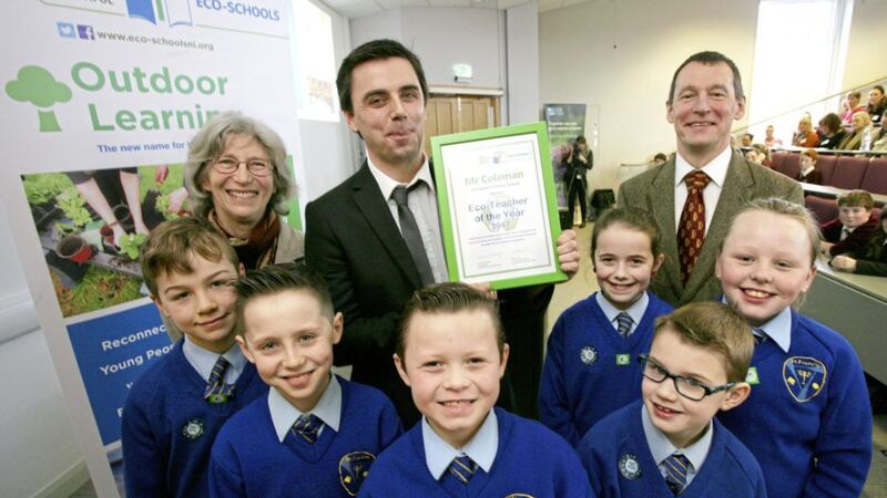 Dwyer Coleman pictured with pupils and Dr Sue Christie and Dr Ian Humphreys from Keep Northern Ireland Beautiful 