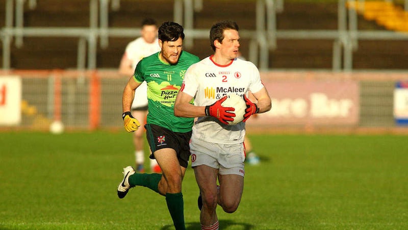 Queen's Martin Clarke chases after Tyrone's Aidan McCrory in Healy Park last Sunday <br />Picture by S&eacute;amus Loughran
