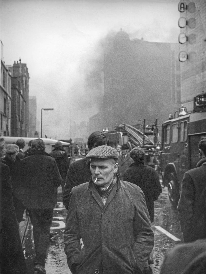 Aftermath of a bomb in factory behind the old ABC Ritz Cinema in Belfast. If you recognise the man in this photo, Bobbie would like to hear from you at bobbiehanvey@gmail.com 