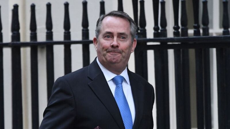 Liam Fox denied sending a tweet - even though there was a massive picture of it on a screen behind him