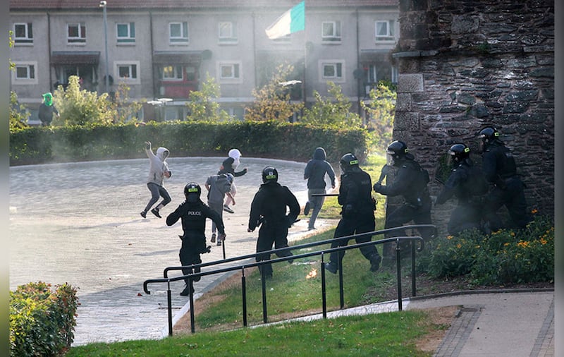 Police chase rioters in Derry. Picture by Margaret McLaughlin