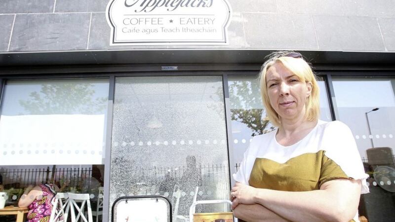 Jackie Bradley outside her business Applejacks Cafe on the Glen Road in west Belfast that has vandalised a number of times since Easter Picture by Mal McCann. 