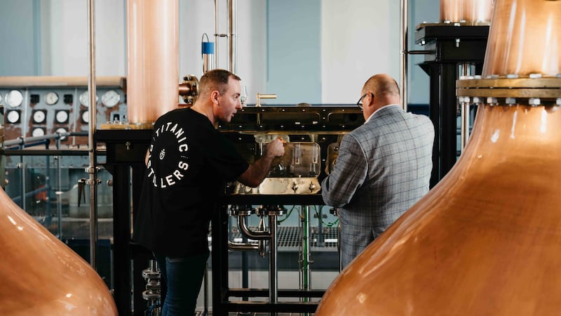 Titanic Distillers director Peter Lavery (right) discusses the whiskey-making process with Head Distiller Damien Rafferty as production started at Belfast’s first working whiskey distillery since the days of prohibition in the 1930s. Titanic Distillers, located on the site of the historic Thompson Dock and Pumphouse in the heart of the city’s Titanic Quarter, was granted its Distillers License to produce spirits last week, and the shiny new copper stills are now up and firing at the distillery as whiskey production got under way in Belfast for the first time in almost 90 years.