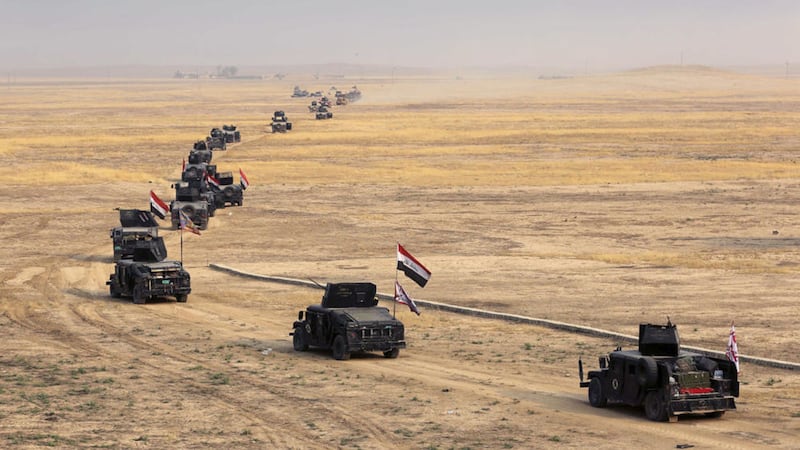 Iraq&#39;s elite counterterrorism forces prepare to attack Islamic State positions in the village of Tob Zawa, outside Mosul. Picture by Khalid Mohammed, Associated Press 