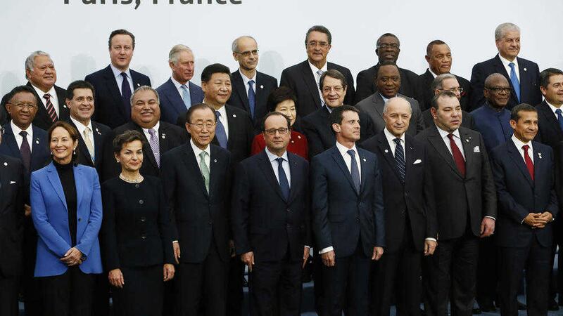 French President Francois Hollande, front centre, poses with world leaders for a group photo as part of the COP21, United Nations Climate Change Conference, in Le Bourget, Picture: Ian Langsdon/AP 