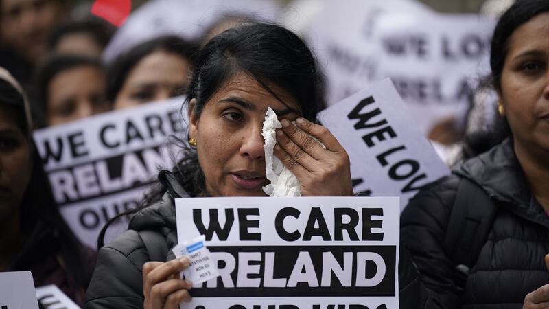 Migrant health workers have staged a protest, calling on the Government to allow them to bring their families over to Ireland without salary restrictions (Niall Carson/PA)