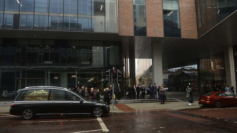 The funeral cortege of Professor Brian Murphy stopped at Ulster University. Picture by Mark Marlow