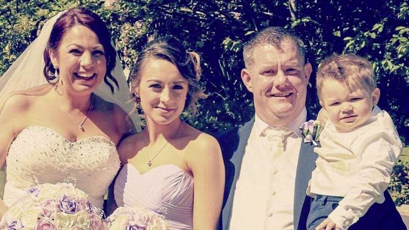 Niall Quinn, pictured with his wife Rosie (left), their son James and her daughter Lauren on their wedding day last June 