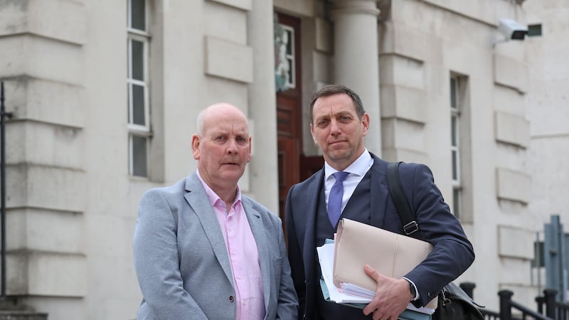 Patrick Thompson(left) pictured outside the High Court in Belfast where his conviction for the murder of four British soldiers in the 1970s was overturned.  Mr Thompson is represented by solicitor Pádraig Ó Muirigh.
PICTURE COLM LENAGHAN