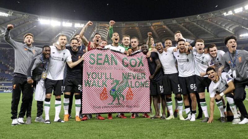 Liverpool celebrate reaching the Champions League Final, with a banner for fan Sean Cox during the UEFA Champions League semi final at the Stadio Olimpico, Rome. Picture by Steven Paston/PA 
