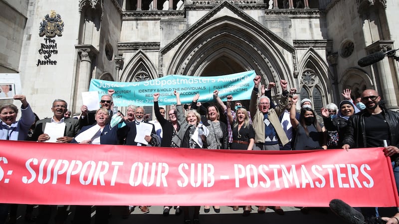 Former Post Office workers celebrate outside the Royal Courts of Justice, London, after having their convictions overturned (PA)