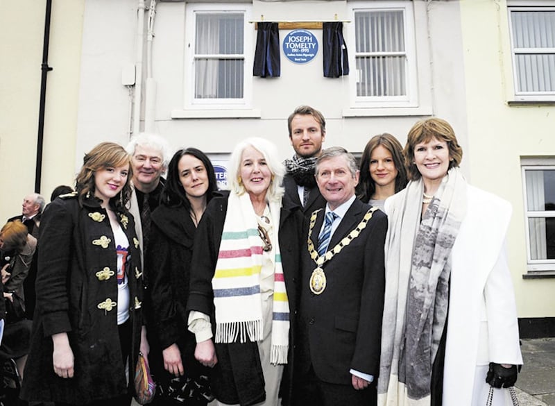 Children and grandchildren of Joseph Tomelty outside his birthplace and home in Portaferry, Co Down where a blue plaque was unveiled. Picture by Mark Marlow