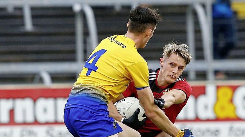 Down&#39;s John McGovern tangles with Roscommon&#39;s Dylan Gaughan during the All-Ireland U20 Football Championship semi-final. Pic Philip Walsh. 