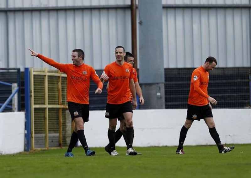 Kevin Branniff pointing towards travelling Glenavon fans. Photo: Pacemaker