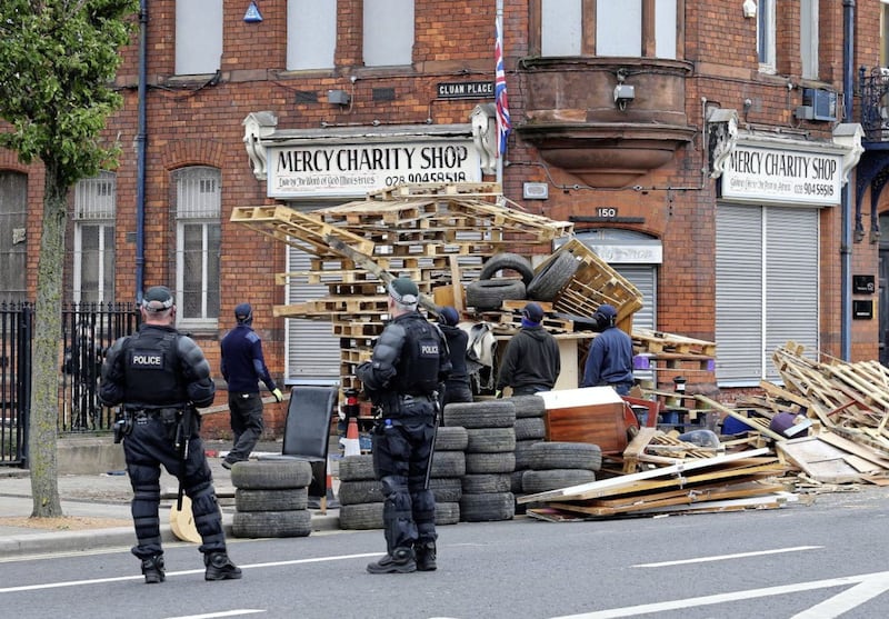 Police and contractors move into Cluan Place in east Belfast to remove a loyalist bonfire from the road. Picture by Mal McCann 