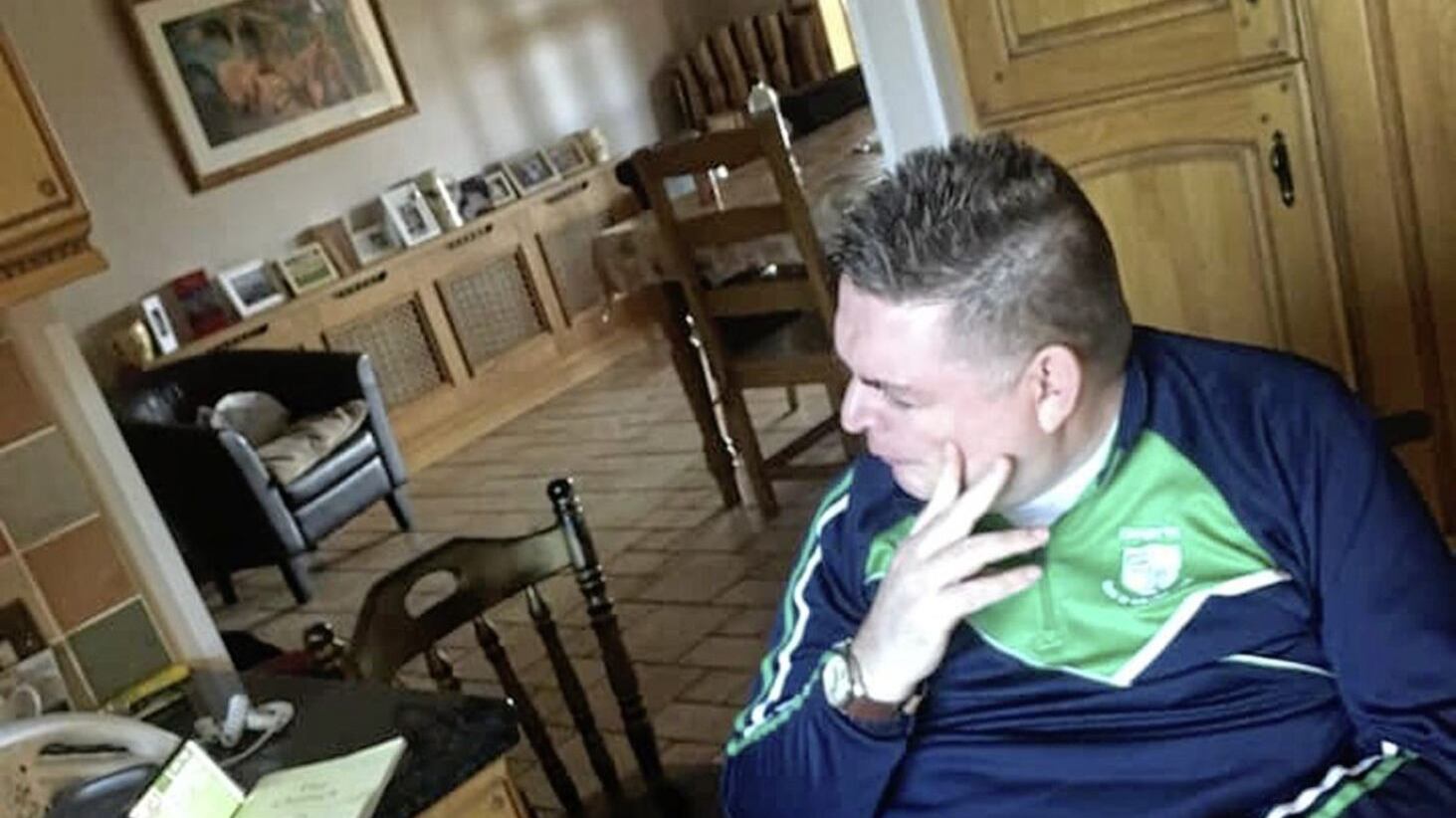 Cargin diehard Stephen McCoy watching a stream of the Antrim football final at home on a phone after he was refused entry to Corrigan Park for the game because there was "no room" and he had arrived after the cut-off point for the entry of cars to the ground.