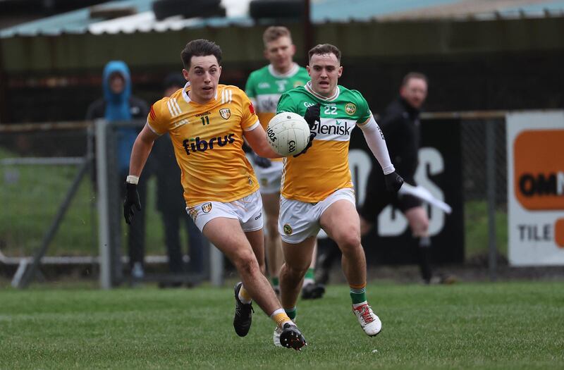 Antrim’s Niall Burns  and Offaly’s Kevin McDermott during Sunday’s Allianz Football League Division 3 match at Corrigan Park in Belfast.
PICTURE: COLM LENAGHAN