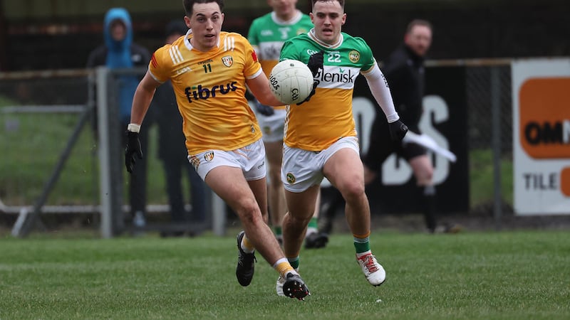 Antrim’s Niall Burns  and Offaly’s Kevin McDermott during Sunday’s Allianz Football League Division 3 match at Corrigan Park in Belfast.
PICTURE: COLM LENAGHAN