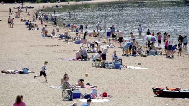 People enjoy the hot weather on the highest beach in the UK at Loch Morlich near Aviemore, as Britons could see the hottest day of the year this Bank Holiday PICTURE: Jane Barlow/PA 