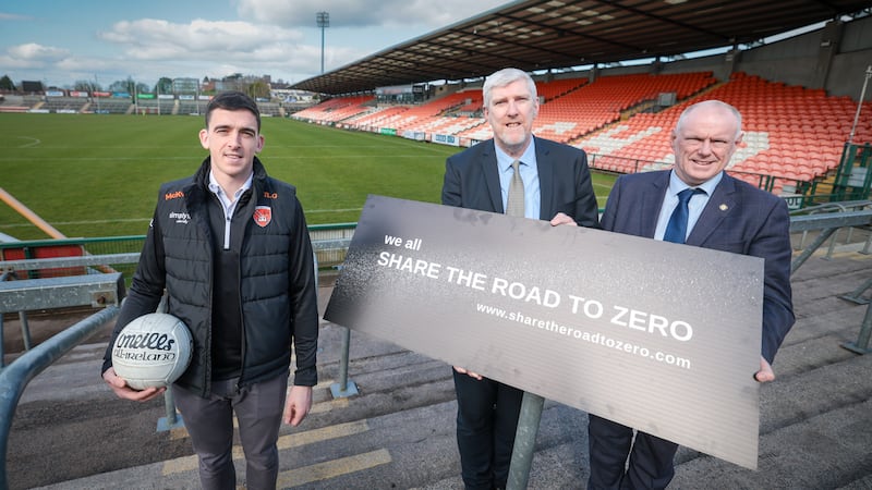Armagh star player Rory Grugan joins Infrastructure Minister John O’Dowd and Ulster GAA Provincial Secretary Brian McAvoy to back the 'Share the Road to Zero' safety campaign.