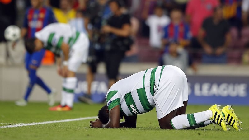 Celtic's Kolo Toure kneels on the pitch at the end of a Champions League, Group C soccer match between Barcelona and Celtic, at the Camp Nou stadium&nbsp;