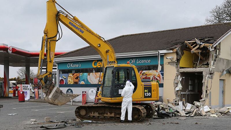 <span style="font-family: Arial, sans-serif; ">A digger ripped a cash machine from the wall of a petrol station on the outskirts of Dungiven, Co Derry, yesterday morning. Picture by Margaret McLaughlin</span>
