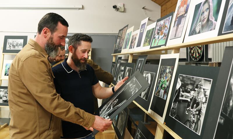 Irish News Picture Editor Mal McCann and Hugh Russell jnr   at A exhibition of Hugh Russell’s work to celebrate 40 years of Photography at Christian Brothers camera Club in North Belfast.