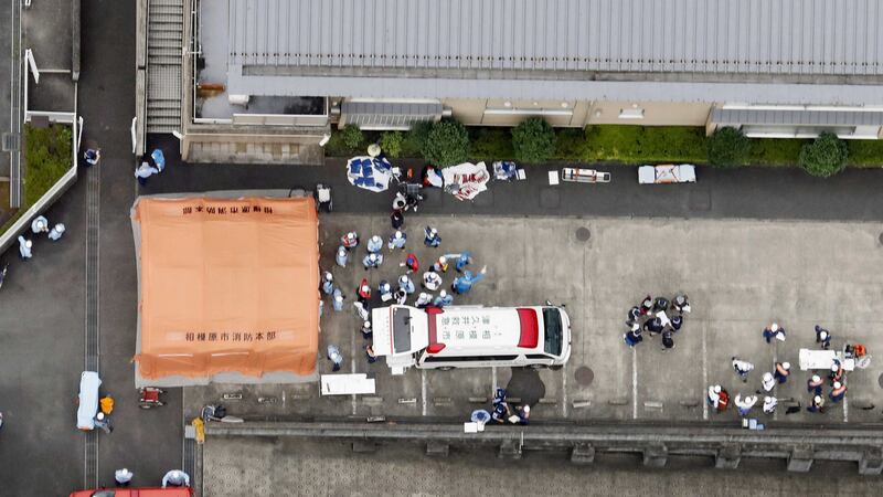 &nbsp;Ambulance crews attend the scene at Tsukui Yamayuri-en facility in Sagamihara (AP Photo)