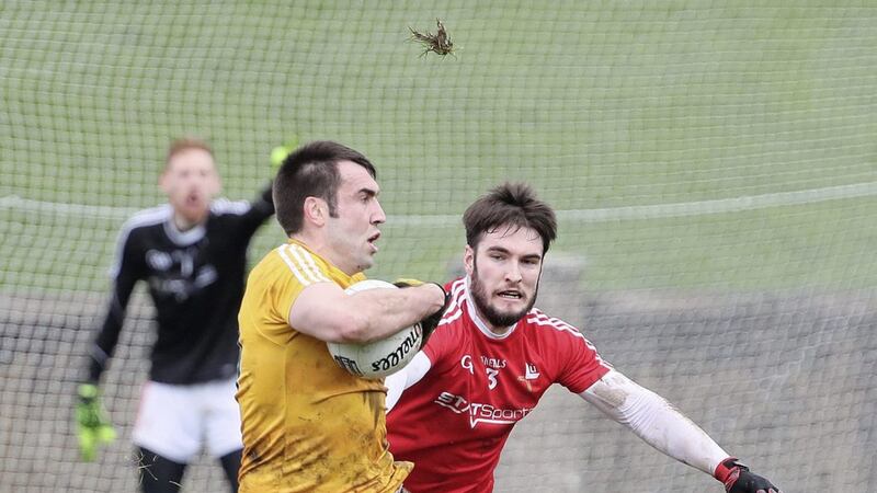 Antrim&#39;s Kevin Niblock and Louth&#39;s Patrick Reilly in action in Drogheda on Sunday. 