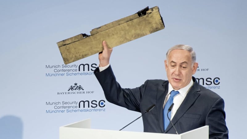 Israeli prime minister Benjamin Netanyahu holds a part of a downed drone during his speech at the Munich Security Conference Picture by Lennart Preiss/MSC 2018/dpa via AP 