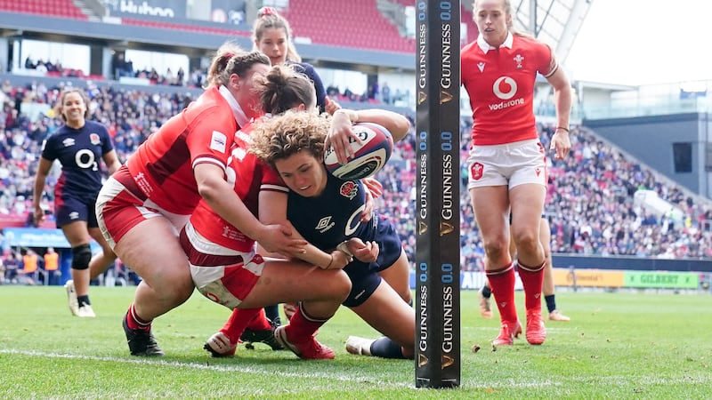 England’s Ellie Kildunne touches down in the win over Wales .