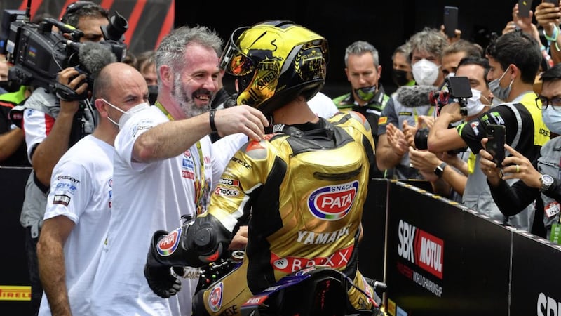 Moneyglass man Phil Marron congratulates Toprak Razgatlioglu after a race. Marron acts as crew chief for the newly-crowned World Superbike champion. 