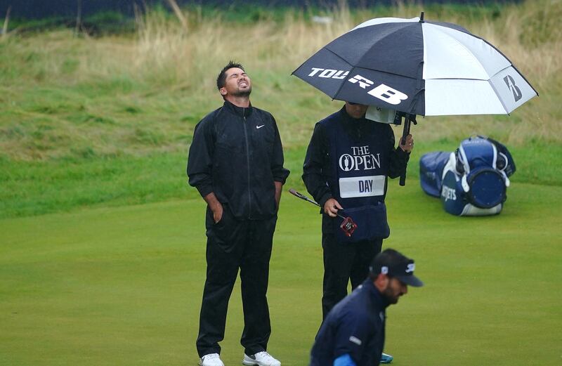 Australia’s Jason Day (left) reacts after missing a birdie on the 18th green during day four of The Open at Royal Liverpool