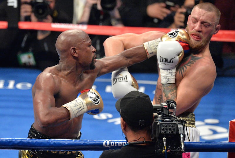 Floyd Mayweather lands with a jarring left hand against Conor McGregor