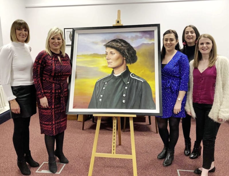 Michelle O&#39;Neill with Sinn F&eacute;in MLAs and the portrait of Countess Markievicz 