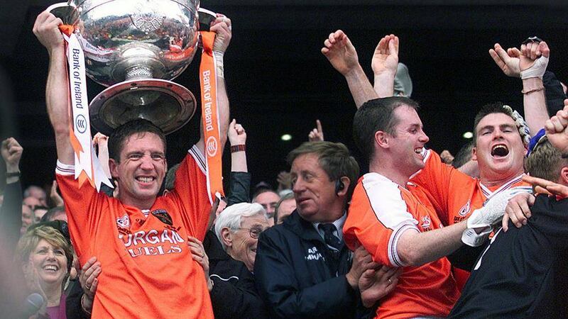 Armagh manager and former captain Kieran McGeeney holds aloft the Sam Maguire Cup after his team defeated Kerry in 2002 