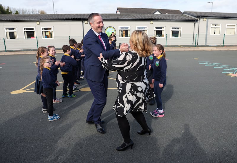 Education Minister Paul Givan takes part in a Ceili, with pupils at Gaelscoil Aodha Rua during his first visit to an Irish language school as Minister.
PICTURE COLM LENAGHAN