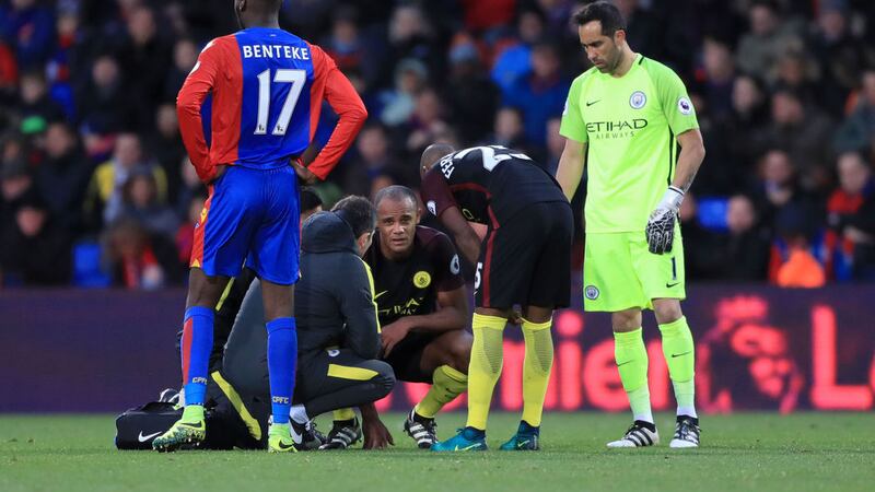 &nbsp;Manchester City's Vincent Kompany receives treatment for an injury during the Premier League match at Selhurst Park. Picture by PA