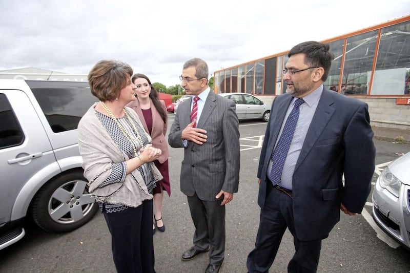 DUP leader Arlene Foster with Dr Raied Alwazzan (left) and Dr Saleem Taneen at an event on the Boucher Road. Picture by Mal McCann 