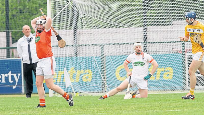 &nbsp; Armagh&rsquo;s Nathan Curry and goalkeeper Simon Doherty react after Antrim&rsquo;s opening goal at Owenbeg yesterday<br />&nbsp;Picture by Colm O'Reilly