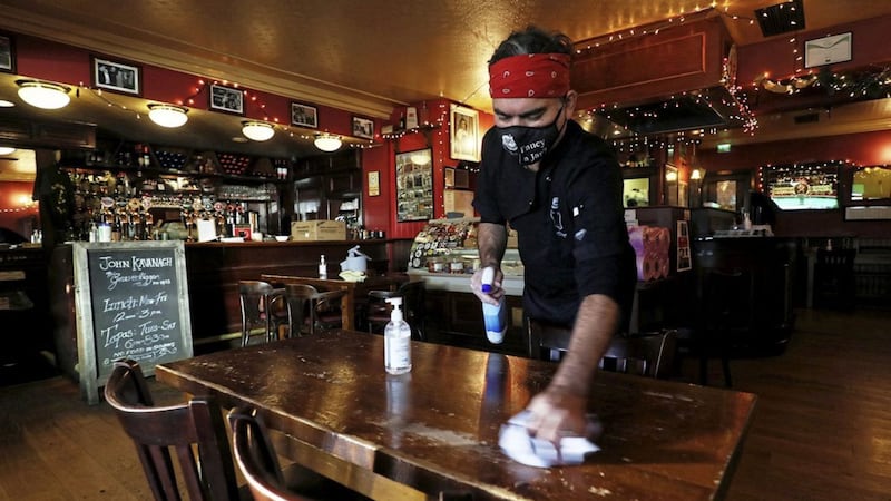 Ciaran Kavanagh, one of the seventh generation of John Kavanagh's bar, locally known as The Gravediggers, makes preparations as they are preparing to reopen the lounge seven days a week.&nbsp; Brian Lawless/PA Wire.
