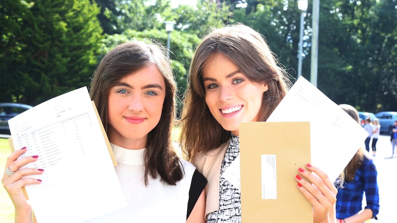 Dominican College Belfast students Lauren Cowan and Laoise Kavanagh celebrate their top results