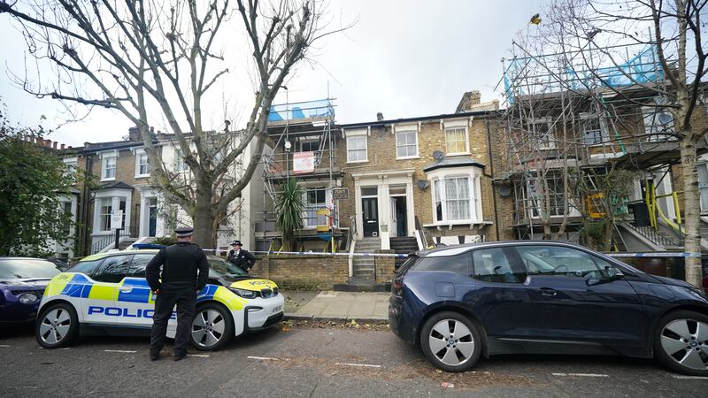 Police officers at a property on Montague Road in east London where a four-year-old boy was found with knife injuries