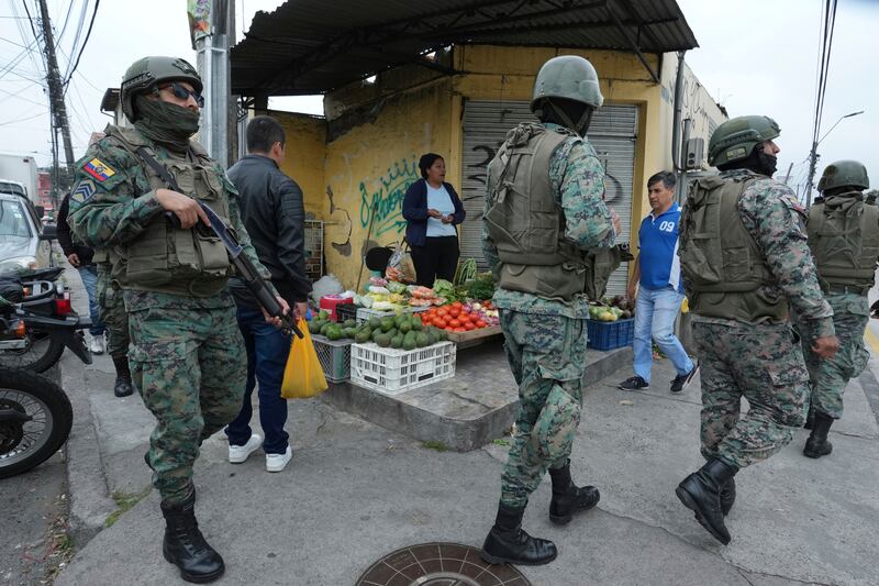 Soldiers patrol the perimeter of Inca prison (Dolores Ochoa/AP)