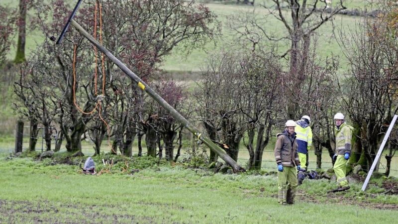 Emergency crew from NI Networks working on a fallen electricity poll in Doagh, Ballyclare, after storm Ophelia. Picture by Brian Lawless, Press Association 