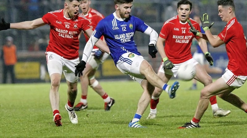 Coalisland&#39;s Padraig Hampsey surrounded by Trillick&#39;s Mattie Donnelly, Lee Brennan and Ryan Gray. 