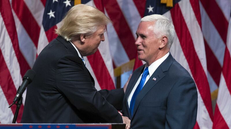 Republican presidential candidate Donald Trump, left, shakes hands with Gov&nbsp;Mike Pence, during a campaign event to announce Mr Pence as his vice presidential running mate. Picture by&nbsp;Evan Vucci, Associated Press&nbsp;