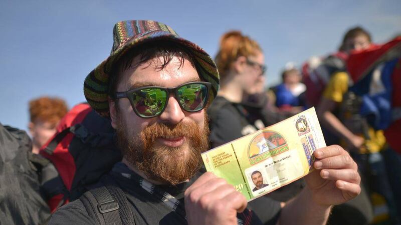 Kyle Walker-Verkuil, from Banchory, Scotland, holds his ticket as he arrives at Glastonbury Festival in Somerset. <br />Picture by Ben Birchall, PA Wire