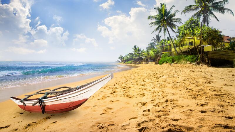 Small boat on a beach in Sri Lanka