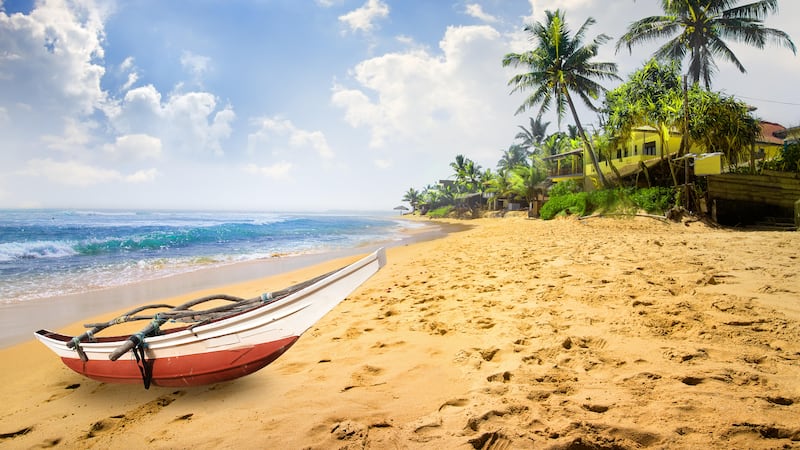 Small boat on a beach in Sri Lanka